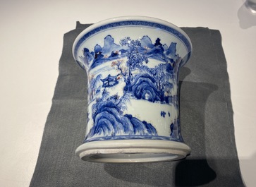 A fine Chinese blue, white and copper red 'Master of the Rocks' brush pot, Kangxi